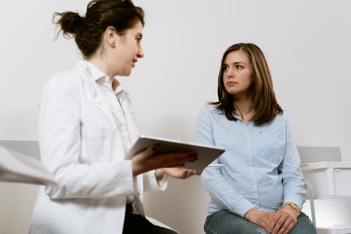 Patient receiving a medical consultation before stem cell therapy